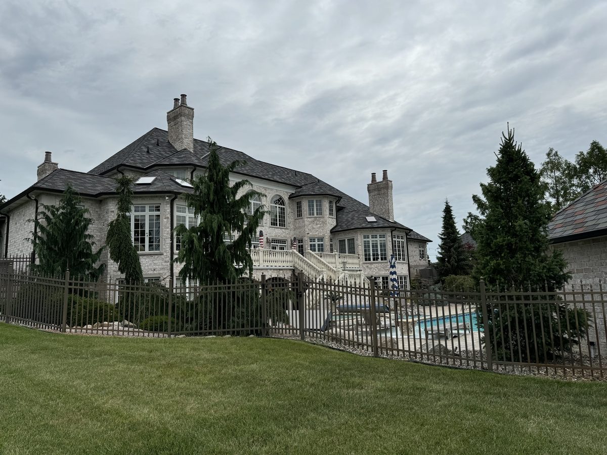 Stone estate home with pool