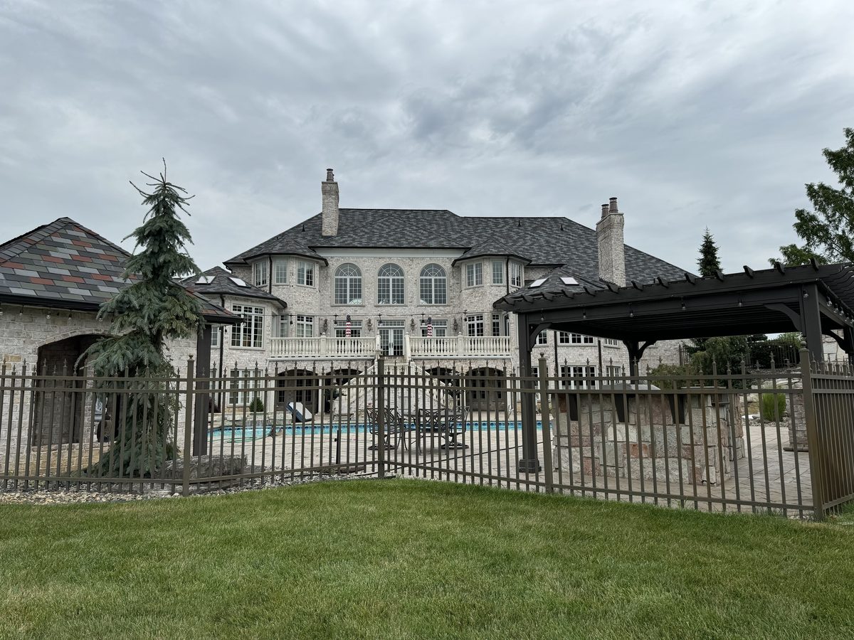 Stone estate home, wide exterior view