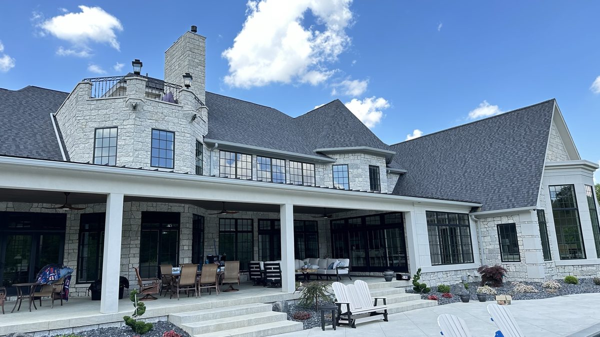 Stone estate home patio and windows